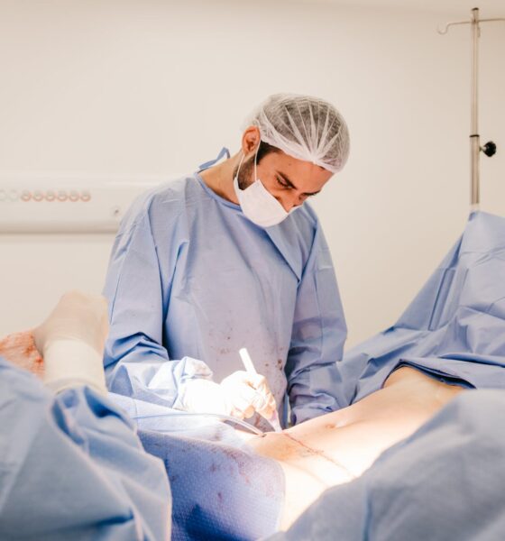 a surgeon operating on a patient